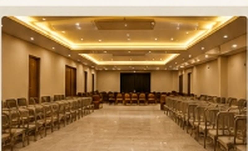 Vikram Bliss Inn Grand Function Hall with banquet seating and cove lighting